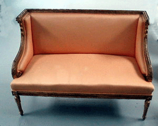 A Louis XVI carved giltwood canapé fetched $1,900.