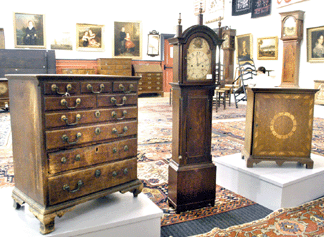 The Pennsylvania walnut child's chest, 2 two feet tall, sold at $30,420; the Massachusetts Federal mahogany dwarf clock signed "John Bailey Jr, Hanover†brought $44,460; and the Pennsylvania Chippendale spice box measuring 22 inches high realized $64,350.