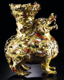 The inlaid gilt-bronze "mythical beast†censer, Qing dynasty, Qianlong period, realized $714,600.