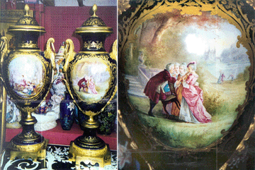 A reward is being offered by a Mamaroneck, N.Y., antiques dealer for information leading to the recovery of this pair of large (40 inches high) bronze mounted cobalt blue and gilt Sevres vases with bronze acorn decorated tops. A detail from one of the 40-inch Nineteenth Century vases is shown at right.