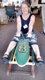 Linda Steele, Claremont, N.H., was wishing there was some snow on Okemo Mountain so she could take the child's bobsled for a ride. 