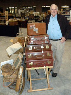 Buzz Eichel of Owl's Head Antiques, Vermont, with collection of vintage English luggage. 