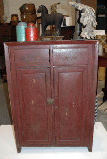 Missouri Plain Folk, Sikeston, Mo., showed this unusual homemade dresser that had come out of a Beltville, Ohio, house. Its maker used wooden crates for the drawers and sides and pieces of tin for the dovetails.