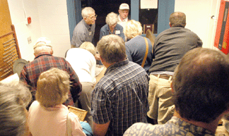 Booths became packed with anxious buyers within minutes of the opening. The crowd was so thick in Doug Blanchard's booth that he could barely write receipts fast enough.