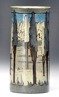 A Saturday Evening Girls cylindrical vase decorated in cuerda seca with a village seen through tall trees fetched $57,000.