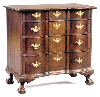 This New England Chippendale block front chest in cherrywood, Massachusetts or Connecticut, 35 inches high, case width 33 inches and 20 inches deep, sold just over the low estimate for $44,080.