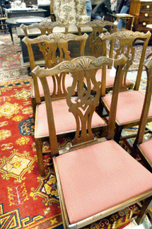 The set of six cherry Chippendale chairs with shell carved crests sold reasonably at $6,900.