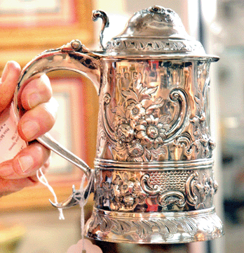 R&S Antiques, New York City, showed this 1777 silver tankard made by Thomas Wynn.
