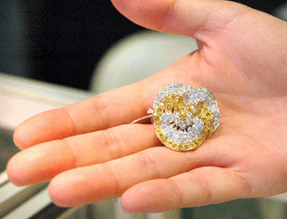Brad Reh, Southampton, N.Y., holds a vintage Oscar Heyman pansy brooch, platinum and 18K yellow gold with diamonds.
