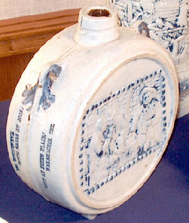 Dutch Hollow Antiques, Aurora, Ohio, was offering, for $1,295, a canteen-formed jug, made in New York and used by a liquor company from Waxahachie, Texas, circa 1890. 