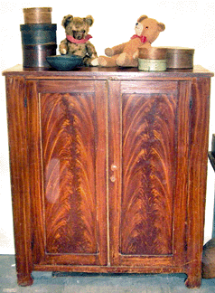 Lois Robinson, Charlotte, N.C., has been exhibiting at Music Valley since the beginning about 20 years ago. Here she shows an early grain painted cupboard.