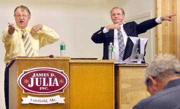 Jim Julia calls bids while Dudley Browne, head of the lamp and art glass division (also, assistant auctioneer), helps spot bidders.
