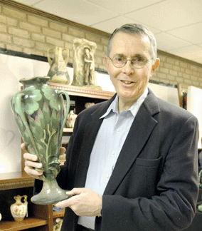 Paul Martinez of Paul's Pots, Westminster, Mass., is holding one of a pair of rare 1900 amphora exhibition vases that were shown in Paris, Leipzig and Turin in the early Twentieth Century. 