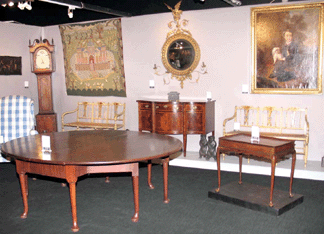 A very large Queen Anne mahogany table, $165,000, and a small New England Federal inlaid sideboard, $110,000, were highlights at G.K.S. Bush, New York City.