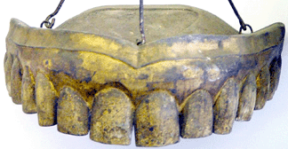 A dentist's trade sign made of tin by Cushing & White of Waltham, Mass., circa 1880s, brought $49,720.