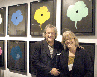 New York City dealer Mary Ryan with artist Donald Sultan, whose silkscreens are in the background. Mary Ryan Gallery, Inc, New York City.