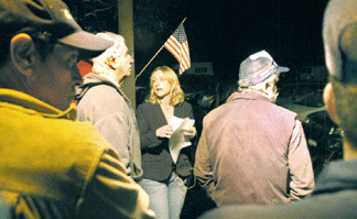 Marianne Flannery began the auction outside selling some farm equipment.