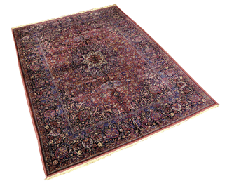 This Persian Sarouk rug, circa 1910, 13 feet 4 inches by 9 feet 10 inches, brought $15,210.
