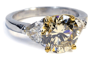 Leading jewelry offerings was a three-stone diamond 18K yellow gold and platinum ring that brought $12,870.