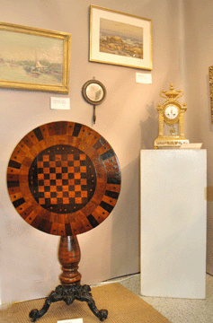 A folky inlaid tilt top stand was eye candy at Charles F. Breuel Antiques, Glenmont, N.Y.