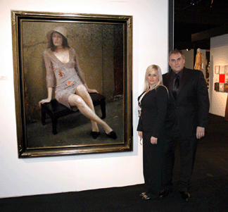 Wendt Gallery co-owners Joseph and Serina Manqueros of Laguna Beach, Calif., were first-time exhibitors. They are standing next to Joseph Todorovitch's "Kristin,†oil on linen, 60 by 48 inches.