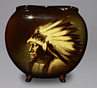 Emblematic of the romanticized image of the American Indian is this portrait vase decorated by Adeliza Drake Sehon bearing a likeness of Hollow Horn Bear, 1901. The Rookwood Pottery Company, collection of James J. Gardner.