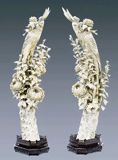 A monumental pair of elaborately carved phoenix standing in fields of intricately articulated peonies sold for $24,000.