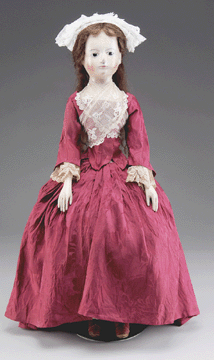 Topping the list of dolls was a rare large 28-inch Eighteenth Century English wooden doll with great facial features. It came to the block with an estimate of $20/30,000 and finished up at $37,950