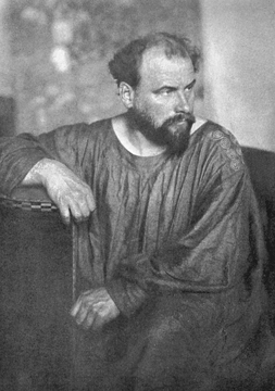 This photograph, published in a book on the occasion of the 25th anniversary of the Wiener Werkstätte, shows a bearded, berobed Klimt seated on a chair designed by Josef Hoffmann in 1905. 