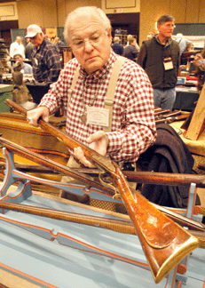 Lancaster, Penn., dealer Stephen Hench was on hand with a good selection of Kentucky-style long rifles, including this well-figured tiger maple and ornately carved long rifle by Canaan, Conn., maker Hiram Deming.