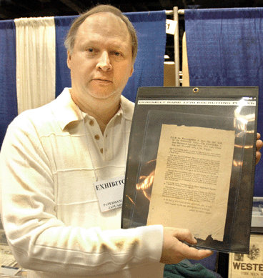 Eric Caren, Lincolndale, N.Y., with an extremely rare 1776 recruiting poster, which he sold at the show.