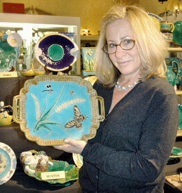 Amid a booth full of majolica, Carol A. Kooperman, Blue Bell, Penn., shows off a George Jones butterfly tray.