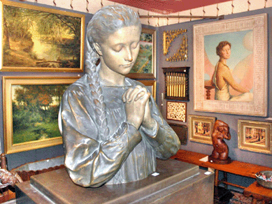 Prominently featured at Mimi Gunn Antiques, Chatham, N.J., was this terra cotta sculpture by H. Allouard and the fetching portrait of Esther Cutler Freeman at right by Wilford Conrow.