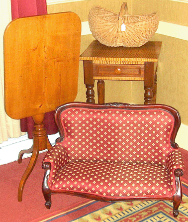 Marilyn Bierylo was not sure if the miniature sofa was a child's piece or a salesman's sample, but she liked it for her Falcon's Roost Antiques, Grantham, N.H.