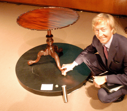 Leslie Keno of the American furniture department with the McMichael-Tilghman family "Acme of Perfection†Chippendale carved and figured mahogany tea table, the carving attributed to the "Garvan Carver,†Philadelphia, circa 1755, that sold for $1,833,000, just under the low estimate of $2 million. ⁄avid Smith photo