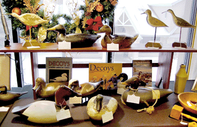 Duck decoys filled several shelves in the booth of North Kingstown, R.I., dealer Raven's Way Antiques. A group of fish decoys was a colorful show.