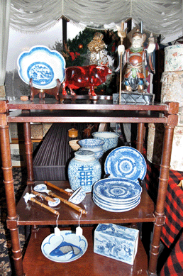 A mahogany étagère shown by Falcon's Roost Antiques, Grantham, N.H.,  displayed an array of blue and white porcelain among which were a Meissen ladle, a Meissen crimper and a Meissen spoon.