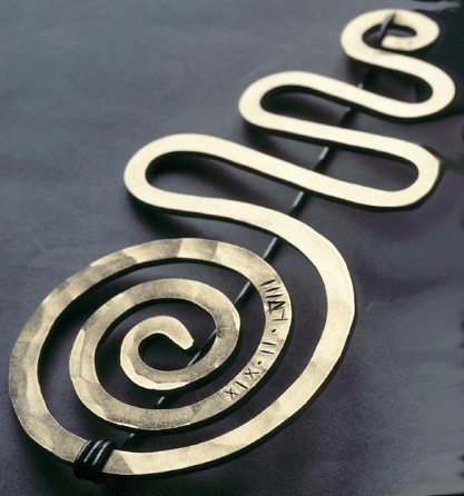 This curvilinear gold and steel wire pin was given by Calder to his wife, Louisa, as a 53rd birthday gift in 1958. The inscription, "XIX.II.L.VIII,†marks the date. This spectacular piece measures 2½ by 5¼ inches. Private collection, New York. ©2007 Calder Foundation, New York City.