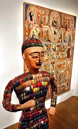 The Ned Chank sculpture "Tall Man,†constructed of cement with broken glass bangles, was $50,000 at Phyllis Kind Gallery, New York City. "Les 92 Personnages,†an oil on canvas by Augustin Lesage, in the background, was stickered "price on request.†