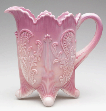 Exceptional pink color helped propel this inverted fan and feather water pitcher made by the Northwood Glass Co./ Dugan Glass Co. to $1,582.