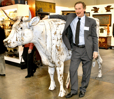 Pennsylvania dealer Greg Kramer with "The Inexhaustible Cow,†an 1881 Coney Island sculpture attributed to Samuel Robb. Described in Fred Fried's book, Artist in Wood, the hollow figure is internally fitted with a mechanism for dispensing milk or, during Prohibition, something stronger.