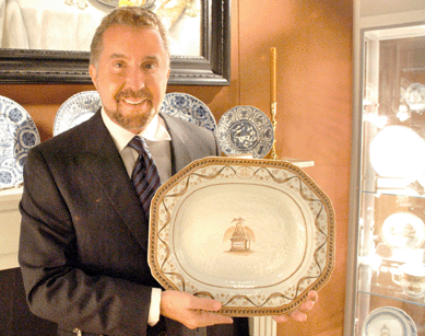 Elizabethtown, Ky., dealer David Overall is shown with an extremely rare platter from "the famed Washington Memorial service ordered by Joseph Sims of Philadelphia to commemorate the death of George Washington.†It was priced at $145,000.