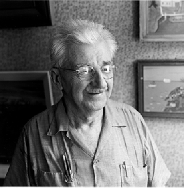 This photograph of Earl Cunningham, taken by Jerry Uelsmann in 1970, shows the crusty artist in his St Augustine antiques shop with some of his precious paintings in the background. Courtesy the Mennello Museum of American Art.