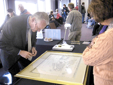 Bill Jenack of William J. Jenack Appraisers & Auctioneers, Chester, N.Y., appraises an early map of New York City.