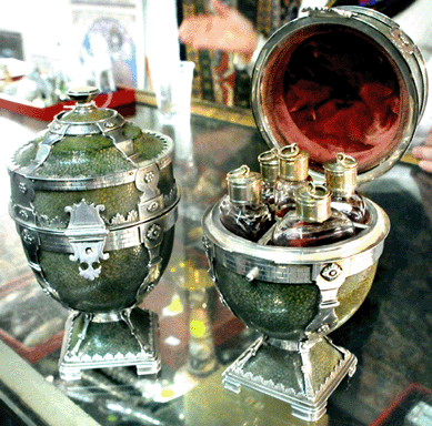 The pair of Nineteenth Century Continental silver mounted Chagrin urn-form perfume boxes sold at $27,600.
