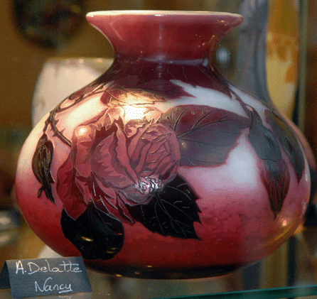 Fine shop units are located in the center; this is part of a large display of Nancy School art glass at Ghyslaine Marlot, Auvergne, central France.