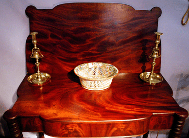 Drake Field Antiques, Longmeadow, Mass., showed a pair of tavern sticks, mid-Nineteenth Century, English brass, flanking a China Trade bowl.