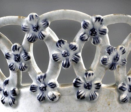 Detail of the interlocking circles and the applied five-petal flowers that are unique to Bonnin and Morris. 
