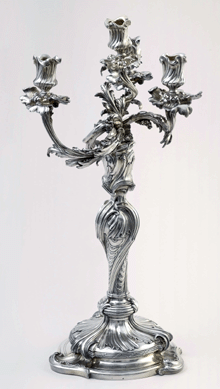 A sparkling silver candelabrum was made in Paris, circa 1739‴0, by Claude Ballin II. It is part of the Cooper-Hewitt collection.