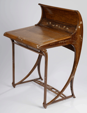 A writing desk designed by Milan artist Carlo Zen, circa 1902, combines the simplicity and symbolism of Art Nouveau. It is made from fruitwood, brass, white metal, mother-of-pearl and leather.